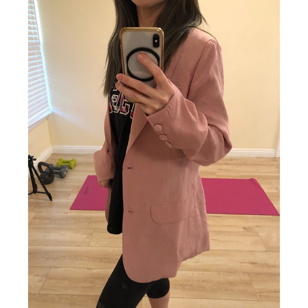 Women’s blazer with waist strap.